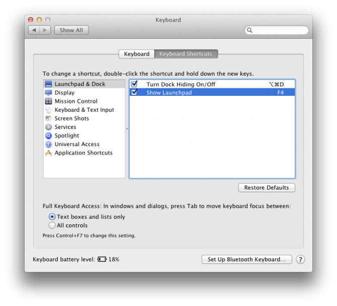 The macOS System Preferences Keyboard Shortcuts pane. "Show Launchpad" is mapped to F4.