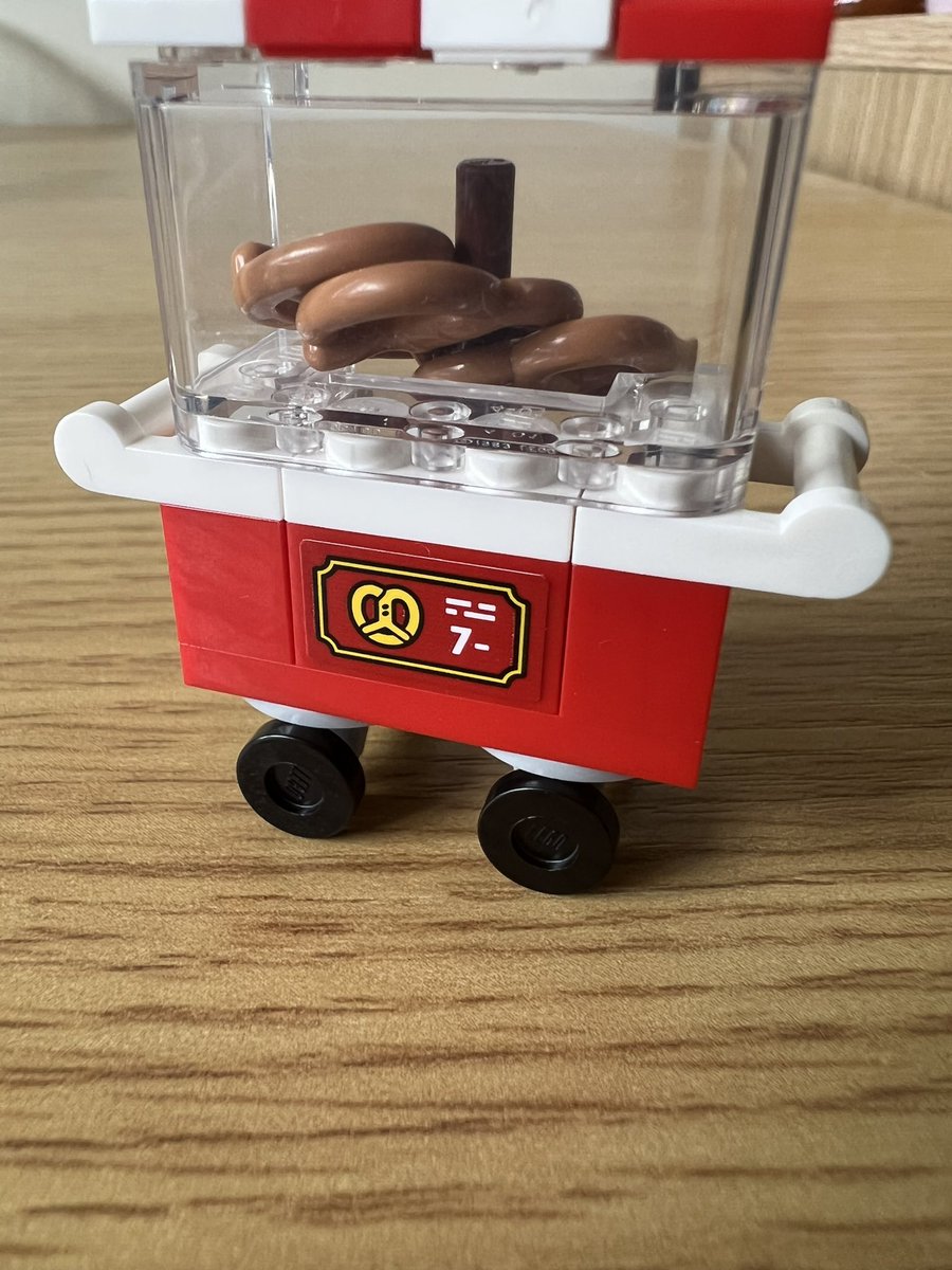 A closeup on the cart showing the sign, where a pretzel costs 7