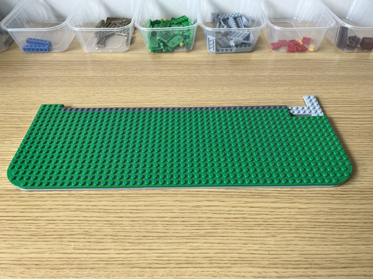 A rectangle of green lego that’s 50 studs wide by 17 studs deep